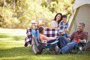 happy family outside tent in the smoky mountains