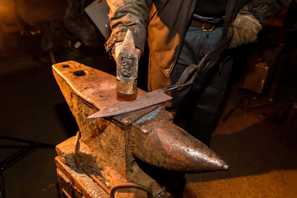 A knife being made in a blacksmith shop.