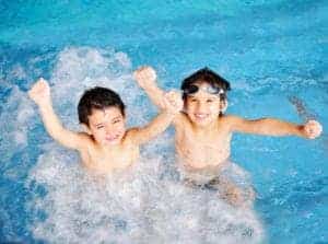 kids swimming in a pool