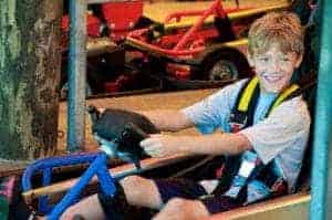 boy riding go karts