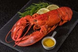 lobster on plate with lemon and butter