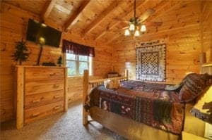bedroom in a pigeon forge cabin rental