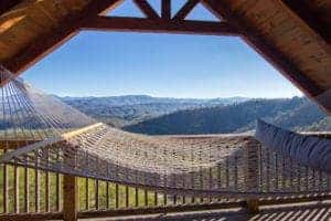 hammock on the deck of a cabin in gatlinburg tn with mountain views