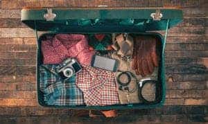 suitcase full of clothes and electronics