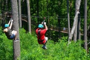 people ziplining at anakeesta