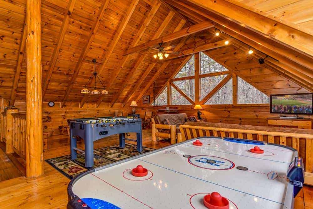 air hockey and foosball inside a gatlinburg cabin