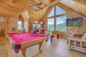 game room inside of a gatlinburg cabin with a view