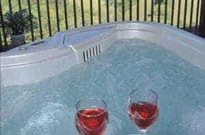 hot tub with two wine glasses