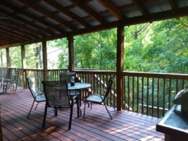 Large covered deck with comfortable seating