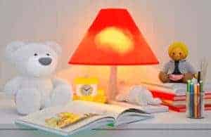 book on nightstand with bear and lamp