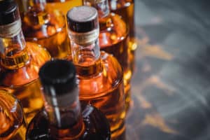 bottles of moonshine on counter at distillery