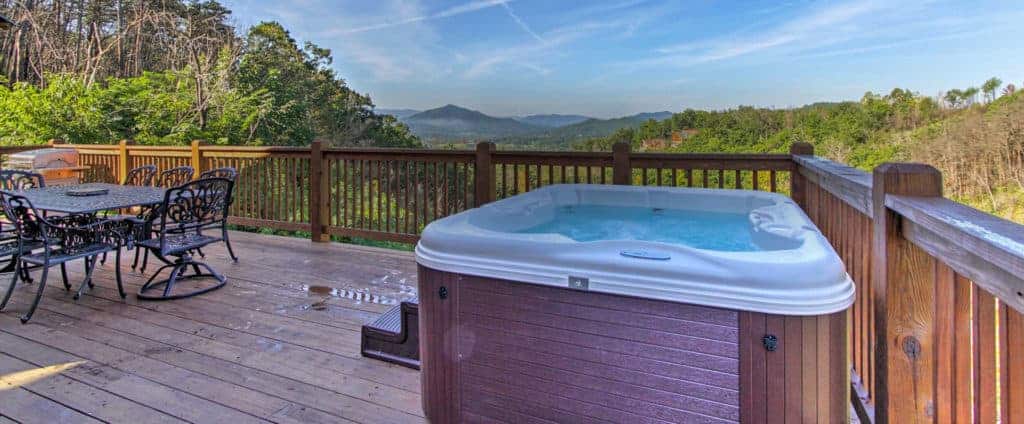 hot tub and patio furniture at a cabin