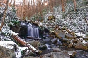 rainbow falls with snow around it