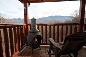 fire pit on deck of smoky mountain cabin