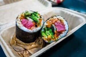 sushi burritos in to go box