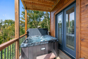 Lower deck off gameroom with hot tub. Magnificent mountain view