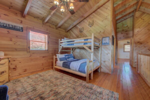 Upper open loft bunkroom w/TV. Queen on bottom/twin on top