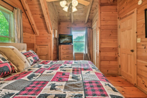 King bedroom upstairs with smart TV and large closet