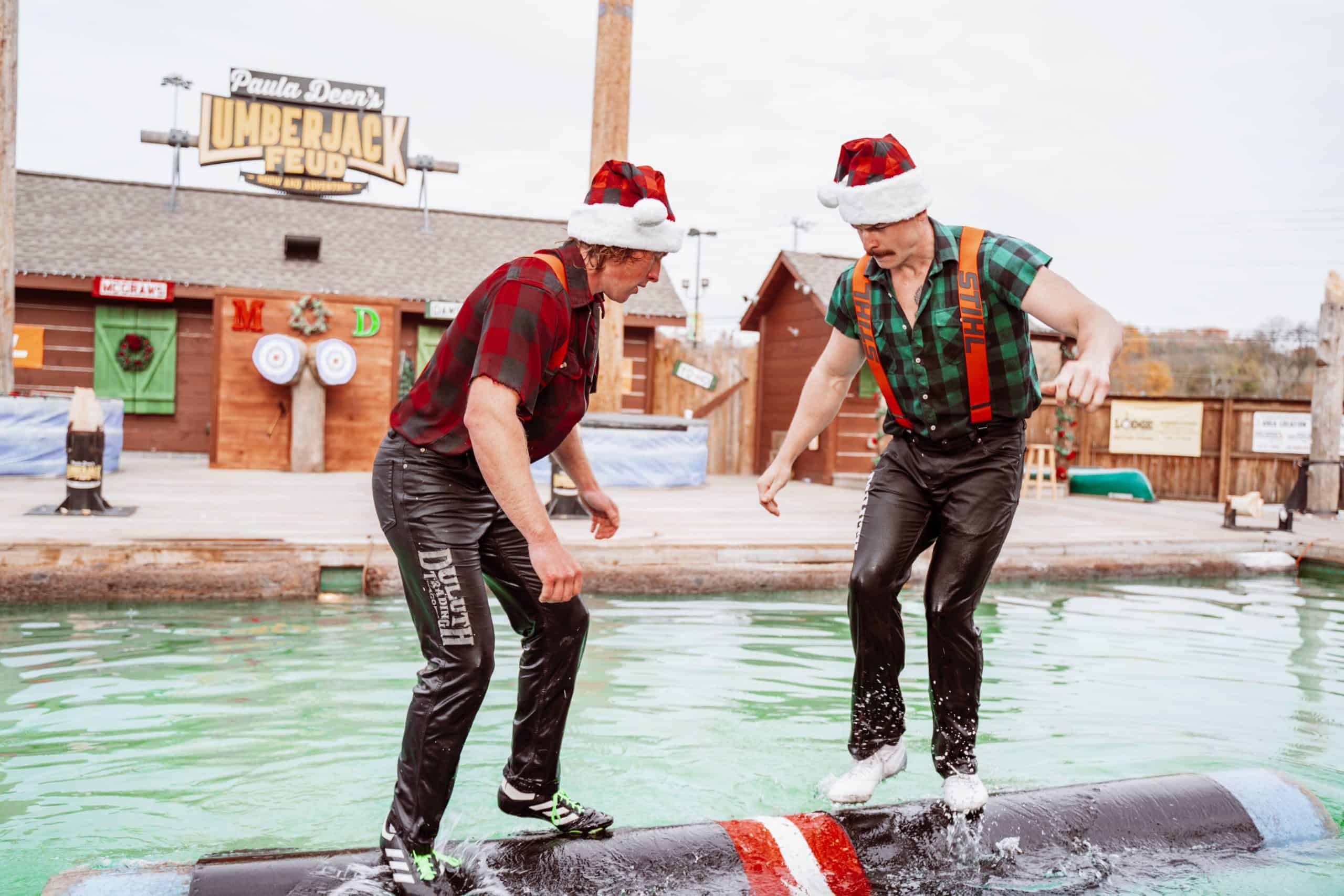 lumberjacks on log roll at Christmas show