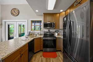 Kitchen is equipped with all brand new black stainless steel appliances.