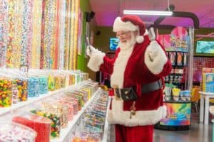 Santa Claus at Crave Golf Club's candy section
