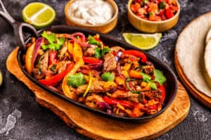 sizzling steak fajitas at restaurant