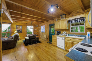 Gypsy Road Wears Valley Log Cabin - Kitchen and Dining Area