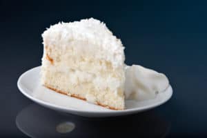 slice of coconut cake on plate