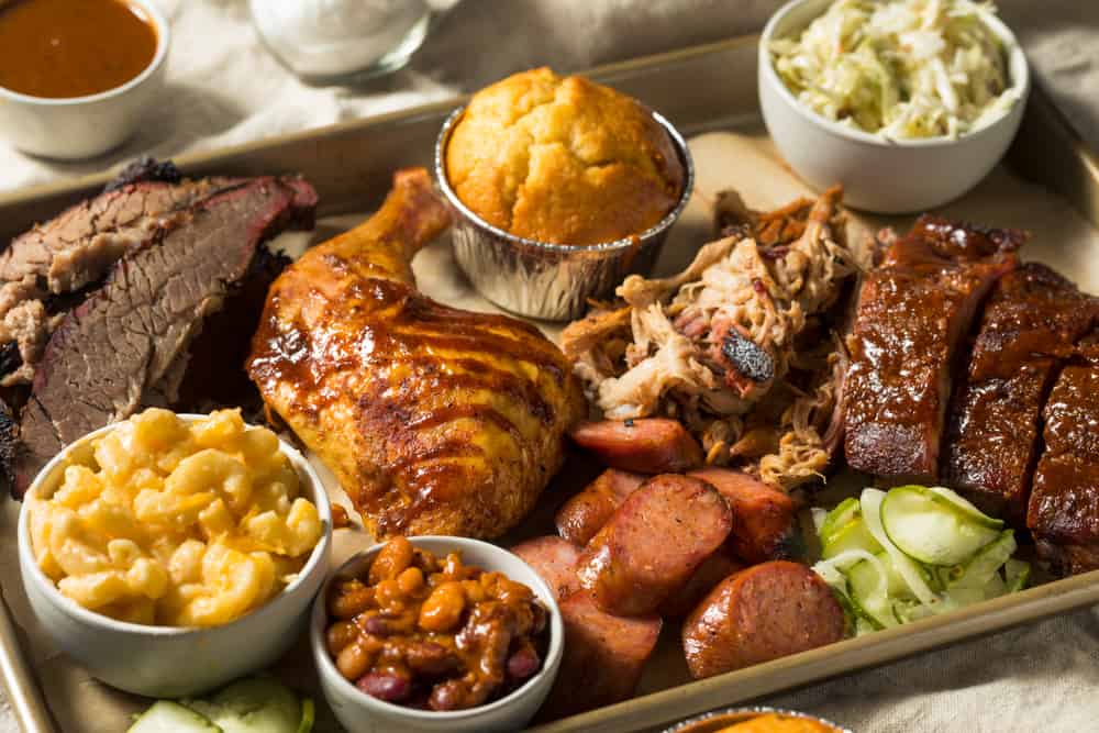 BBQ plate with chicken pulled pork and sides