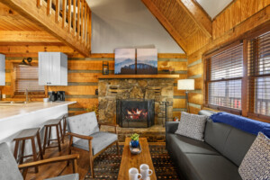 Main level living room with wood burning fireplace.