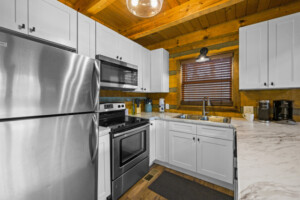 Kitchen with fully stocked cooking and dining utensils!