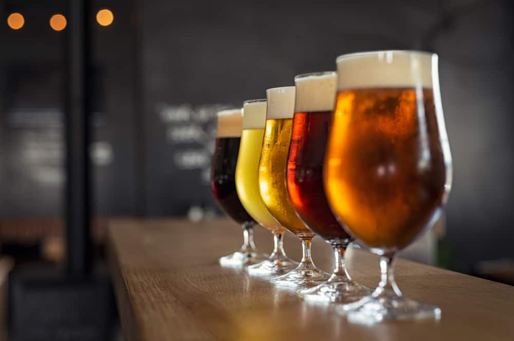 cups of beer on a counter