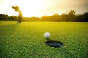 Man hitting a golf ball