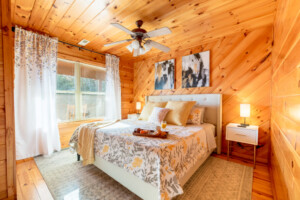 Bedroom #2: Cabin living made easy. This cozy bedroom on the second floor with a king-size mattress will have you hitting snooze over and over.