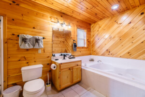 Bath #1: The en-suite owners bathroom on the first floor has a shower and jacuzzi tub