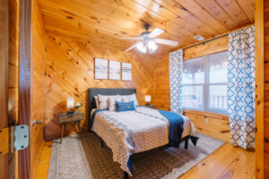 Bedroom #3: This second floor bedroom has a queen-size bed overlooking the backyard