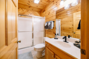 Two additional bathrooms are located on the first and second floors.