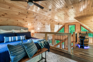 Loft king bedroom with memory foam mattress and view of the floor to ceiling windows