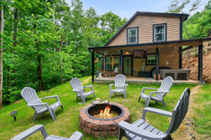 Fire pit with seating for six looking onto the porch with TV