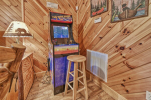 Screened in porch that runs along the length of the cabin offers plenty of places to sit and relax.