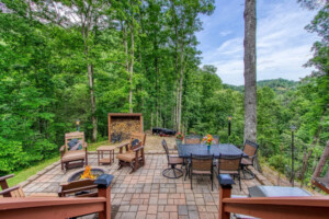 Hot tub and table in screened in covered porch