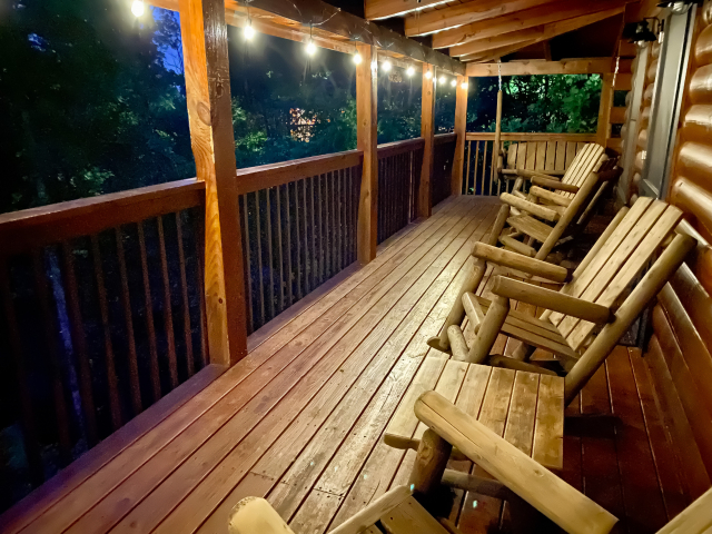 Enjoy evening at wraparound deck with rocking chairs and swing.