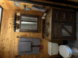 Re-purposed 100 year old wood bathroom vanity with a copper sink