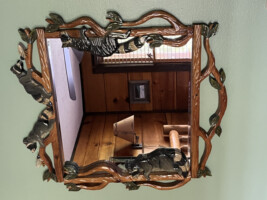 Raccoon carved mirror in the front room