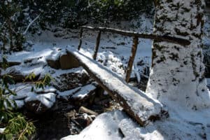 footbridge in the Smoky Mountains covered in snow