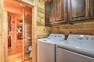 A home-like laundry room complete with a wall mounted ironing system.