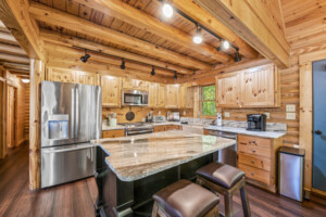 Beautiful fully stocked kitchen with additional seating at the bar