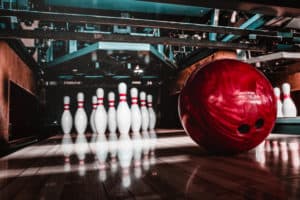 bowling ball striking pins