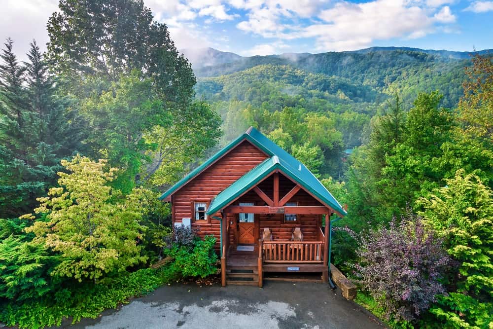 The Whispering Creek cabin in a wooded setting