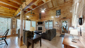 Cabin with vaulted ceilings, open concept living room, dining room, kitchen